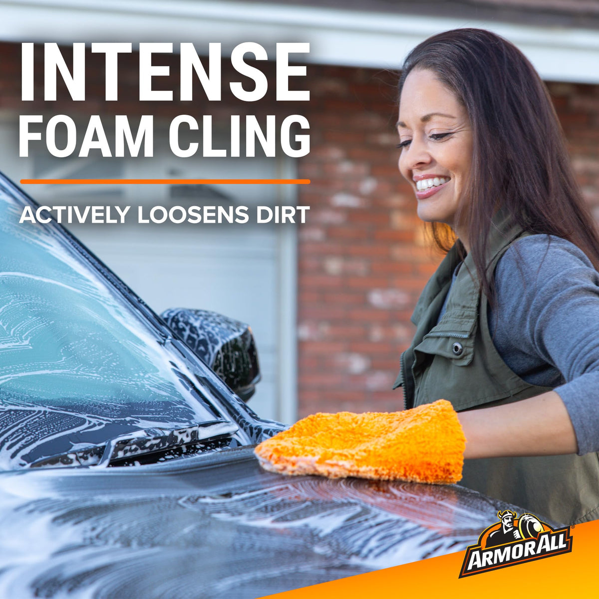 Armor All foam sprayer applying dense foam to vehicle for easier dirt removal