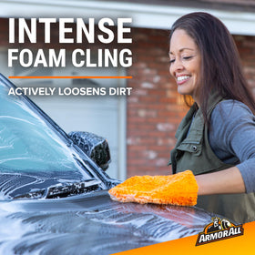 Armor All foam sprayer applying dense foam to vehicle for easier dirt removal