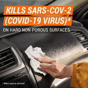 Armor All wipe cleaning a dashboard, demonstrating fast removal of grime and visible freshness