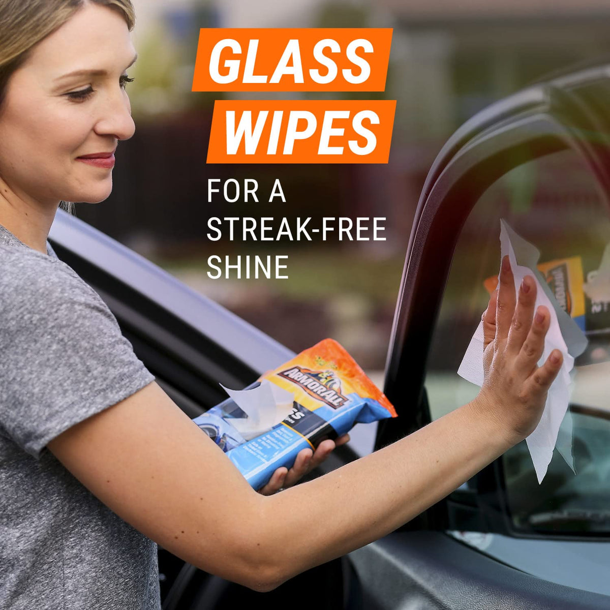 Armor All cleaning wipes removing dirt from car seat and console surfaces