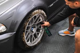 Armour Detail Supply liquid close-up in hand showing texture and low-odor benefit: gentle