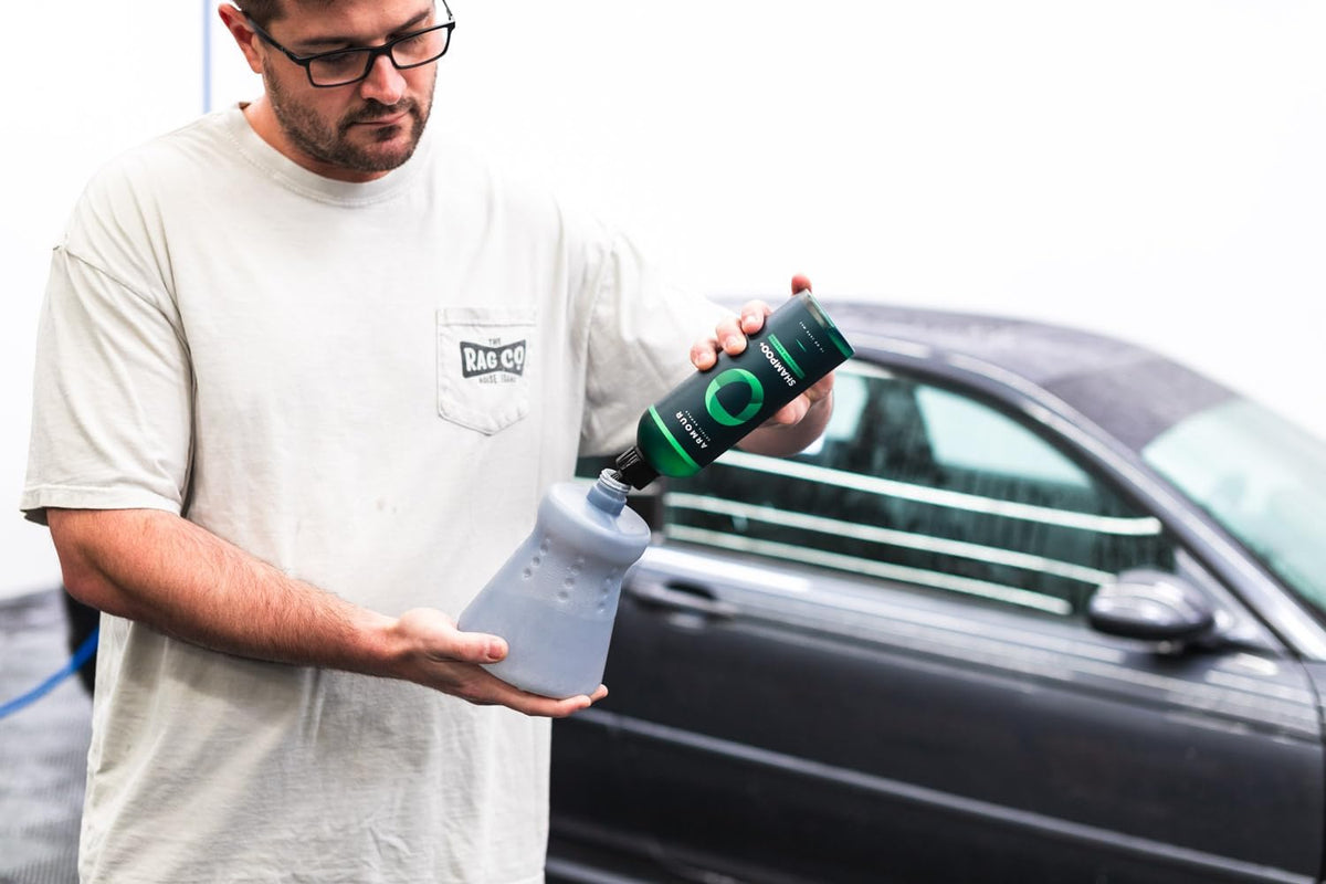 Armour Detail Supply spraying thick foam from foam cannon onto car