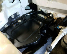 ARONOVA tray installed under hood demonstrates correct fit and secure battery support