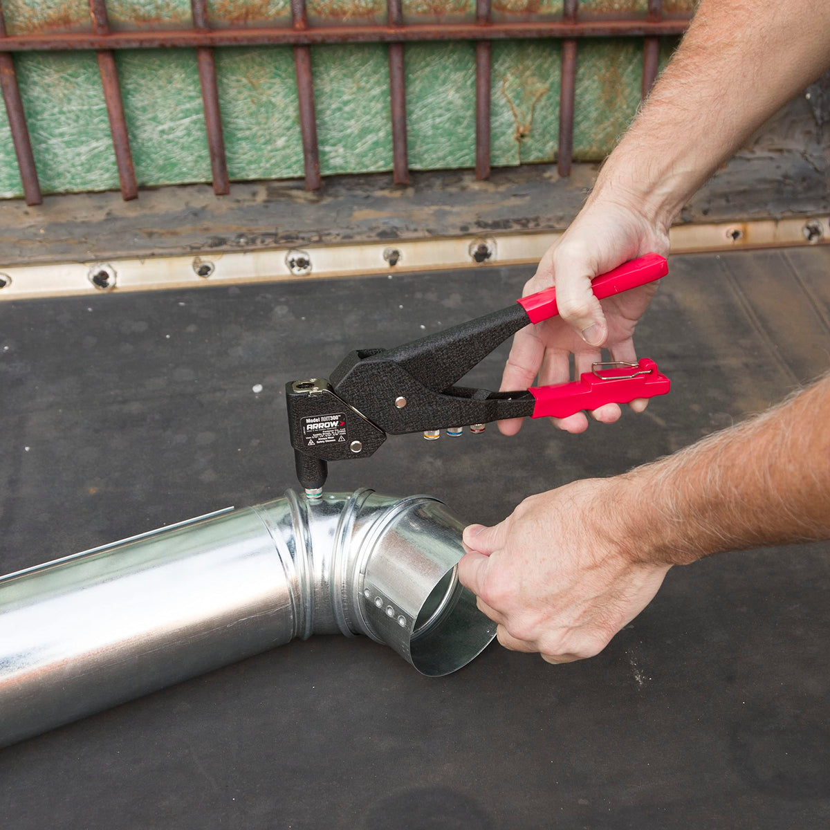 Arrow Fastener RHT300 in use on automotive panel for tight-space riveting