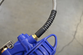 Astro Pneumatic 3018 in use inflating a car tire illustrating precise pressure control and convenience
