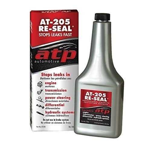 ATP Automotive AT-205 pouring into engine reservoir demonstrating easy application and seal restoration