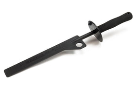 Autofiber brush on garage bench with wheel tools showing professional detailing efficiency