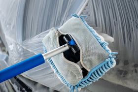 Autofiber extended pole reaching SUV roof for safer washing
