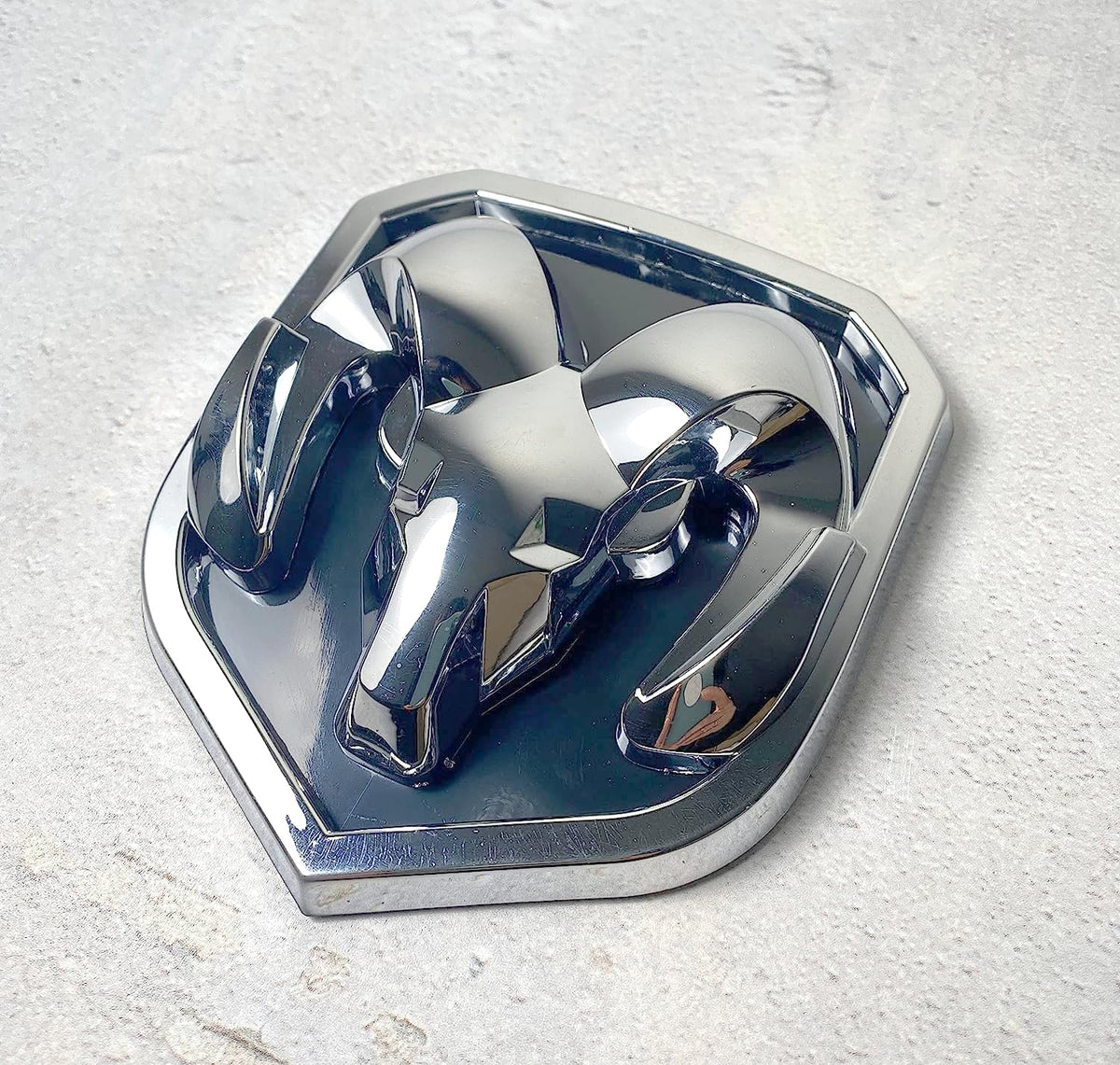 Autogem chrome RAM emblem front view showing mirror finish and upgraded look