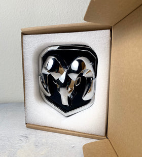 Autogem chrome RAM emblem installed on truck grille showing improved appearance