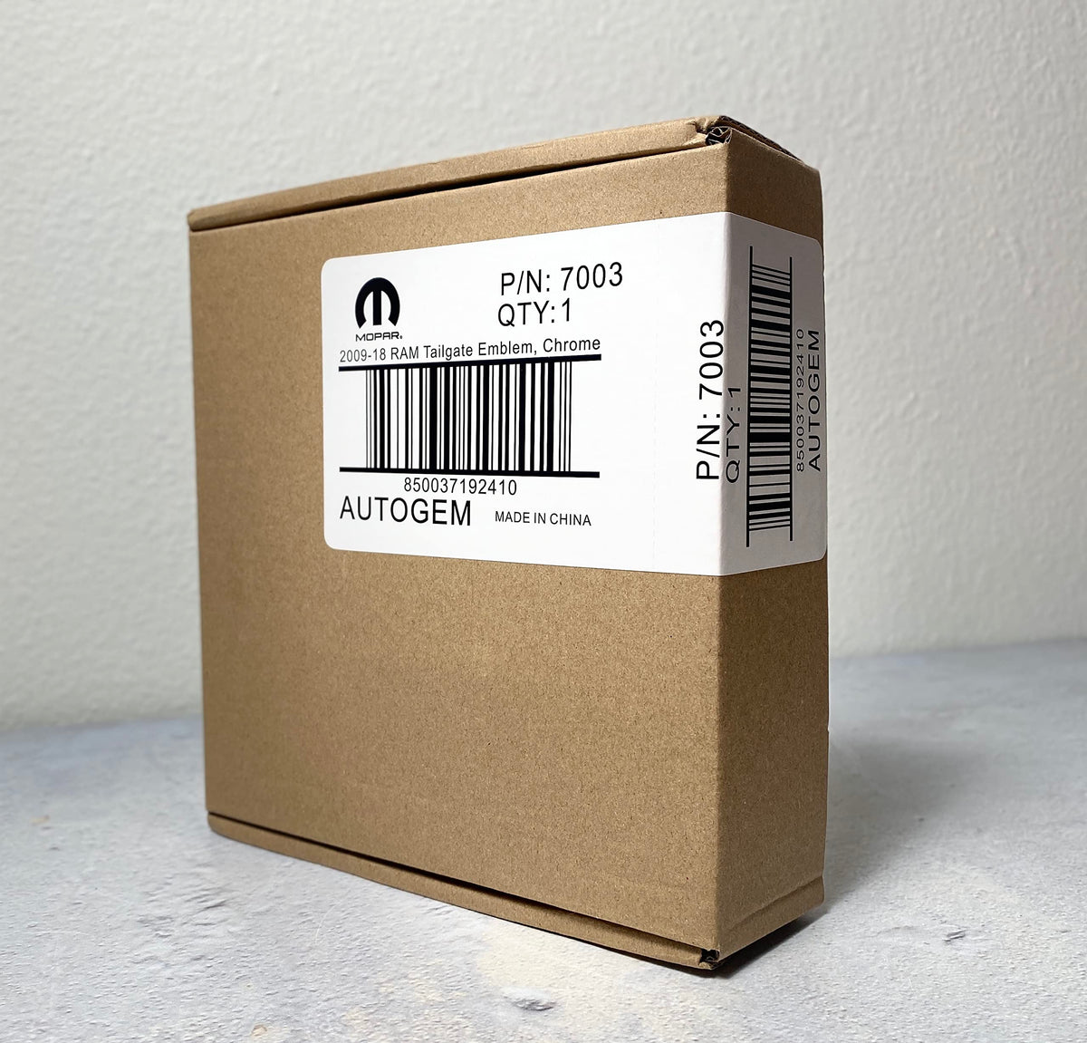 Autogem emblem in package with instructions showing ready-to-install benefit