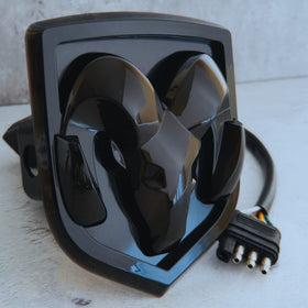 Autogem front view of hitch cover showing illuminated RAM logo and improved visibility