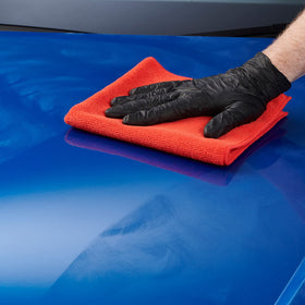 Autoglym polished car in driveway showcasing restored gloss and protection