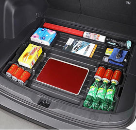 AutoQi positioned beneath cargo floor panel showing discreet installation advantage