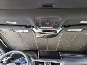 Autotech Park folded next to car key showing compact size and portability