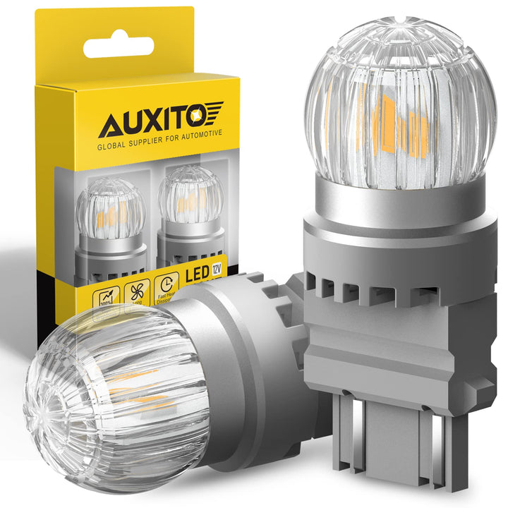AUXITO 3157 amber bulb front view showing full amber glow and improved visibility