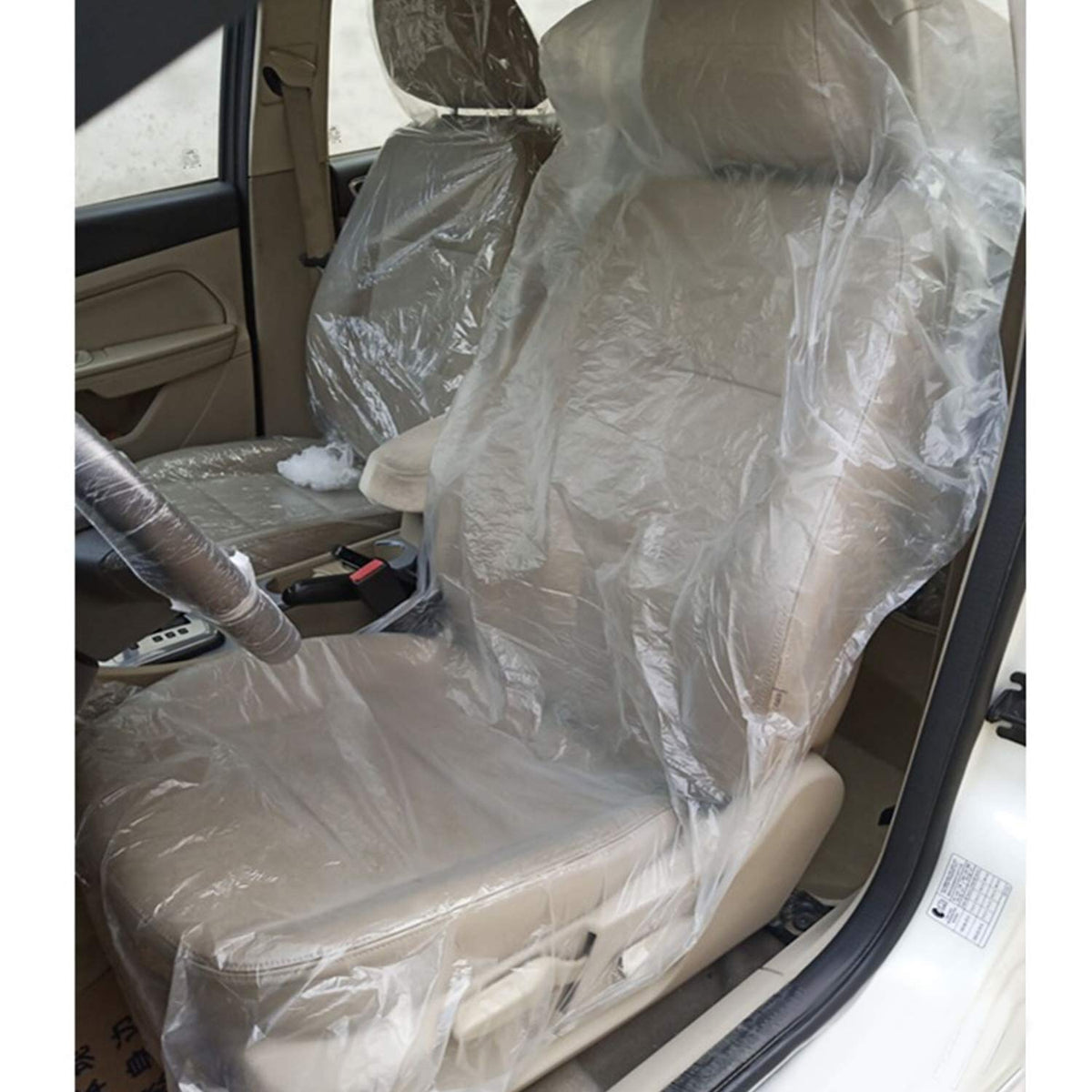 awagas mechanic using cover on car seat showing fast installation and seat protection benefit