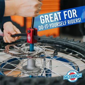 BAJA NO PINCH tool in use mounting a dirt bike tire for safe no-pinch benefit