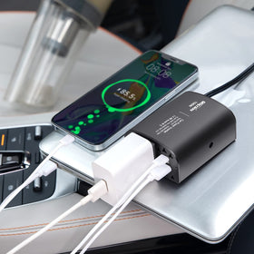 Bapdas inverter plugged into car cigarette socket powering devices on road