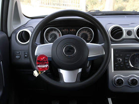 Bashineng knob beside a hand to show size and easier turning leverage