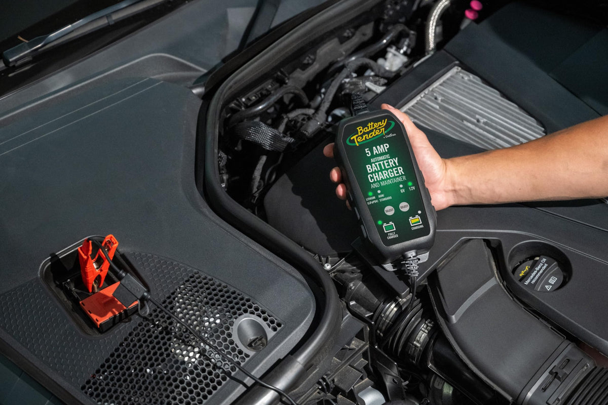 Battery Tender installed under hood charging a car battery, safe connect-and-forget benefit
