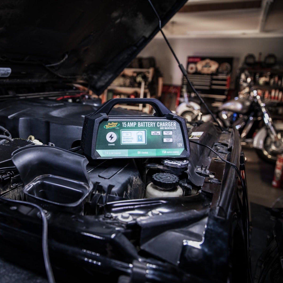 Battery Tender connected to a car battery demonstrating fast charging in use