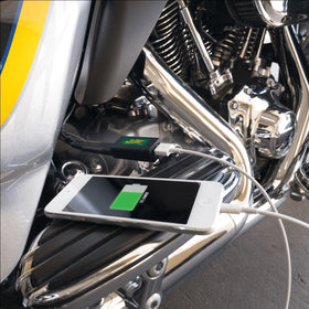 Battery Tender adapter connected to motorcycle battery, provides on-the-go power