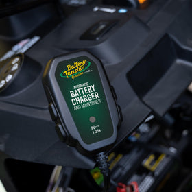 Battery Tender Junior 8V accessories laid out showing included cable, manual, and mounting options