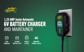 Battery Tender Junior installed in a car trunk showing in-vehicle charging convenience