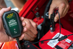 Battery Tender Junior connected to a motorcycle battery demonstrating safe maintenance