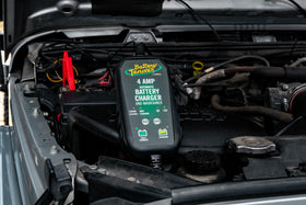 Battery Tender on garage workbench with tools, illustrating shop and seasonal vehicle use