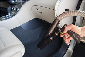 BEMEIS gun in use inside car interior removing dust from seams efficiently