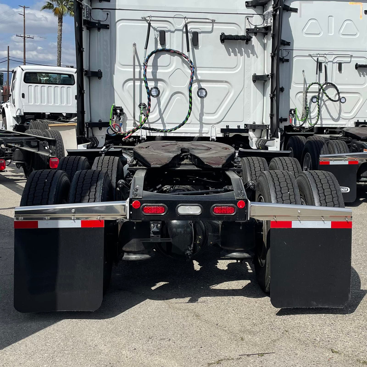 BHTOP mudflap installed on semi trailer reducing spray and debris benefit