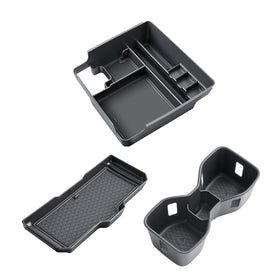 BIBIBO packaging and contents showing the tray, cup insert, and charging mat included