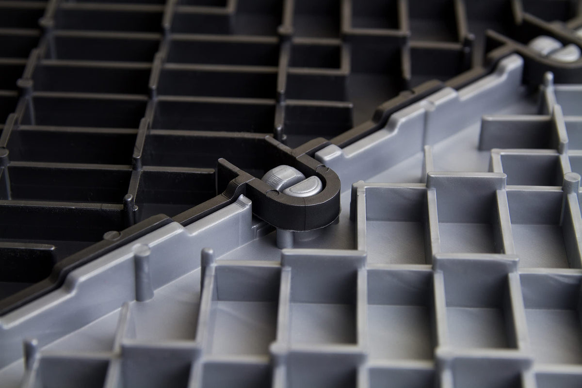 Big Floors installed under a car illustrating durable, protective floor surface
