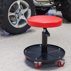 BIG RED mechanic using stool in garage to improve workflow