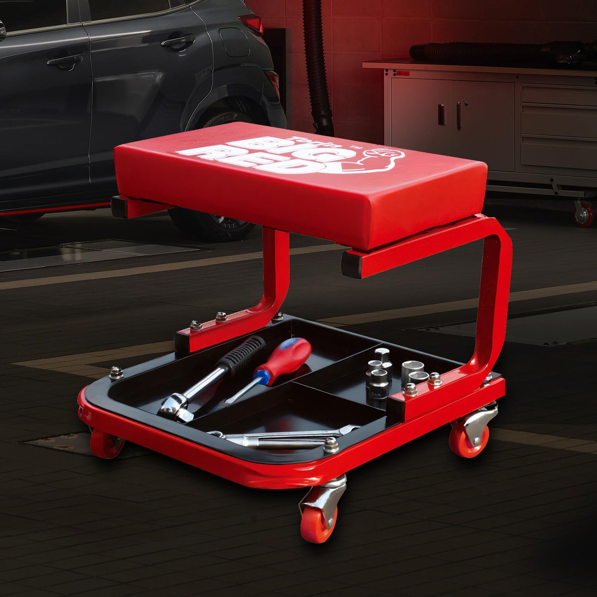 BIG RED stool positioned by car in garage to show workshop use benefit: keeps tools close