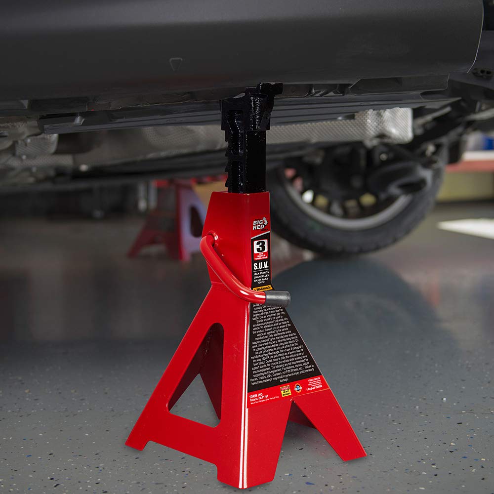 BIG RED jack stand supporting SUV showing hands-free access benefit