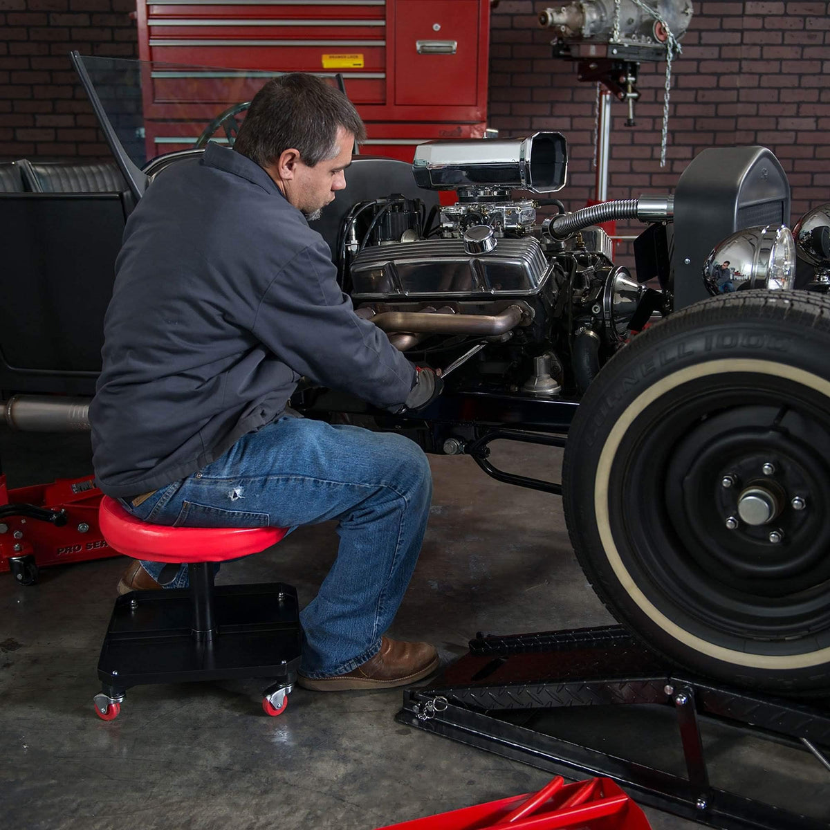 BIG RED stool next to tools showing scale and capacity to support 250 lbs safely