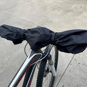 BiKase in use on eBike cockpit protecting display and phone mount from rain