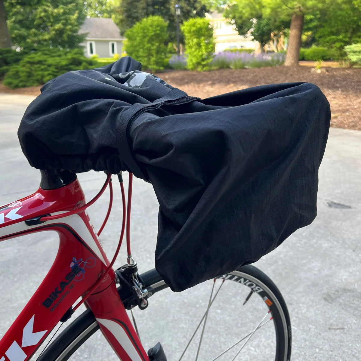 BiKase cover on bike mounted to car rack protecting electronics during transport