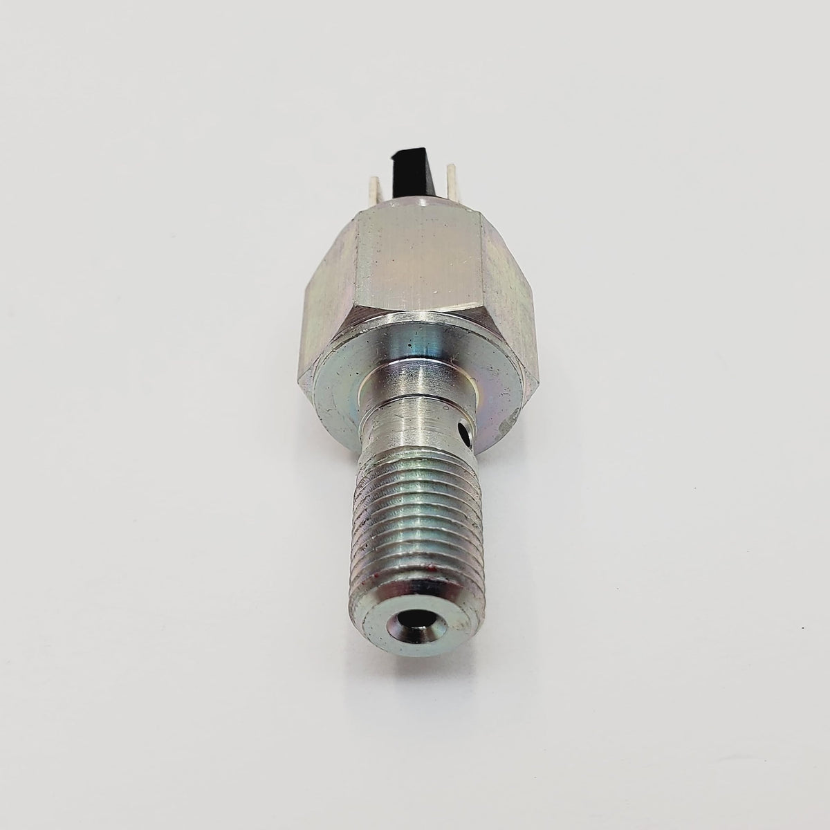 Billet Proof Designs switch installed on Harley rear brake line showing functional fit