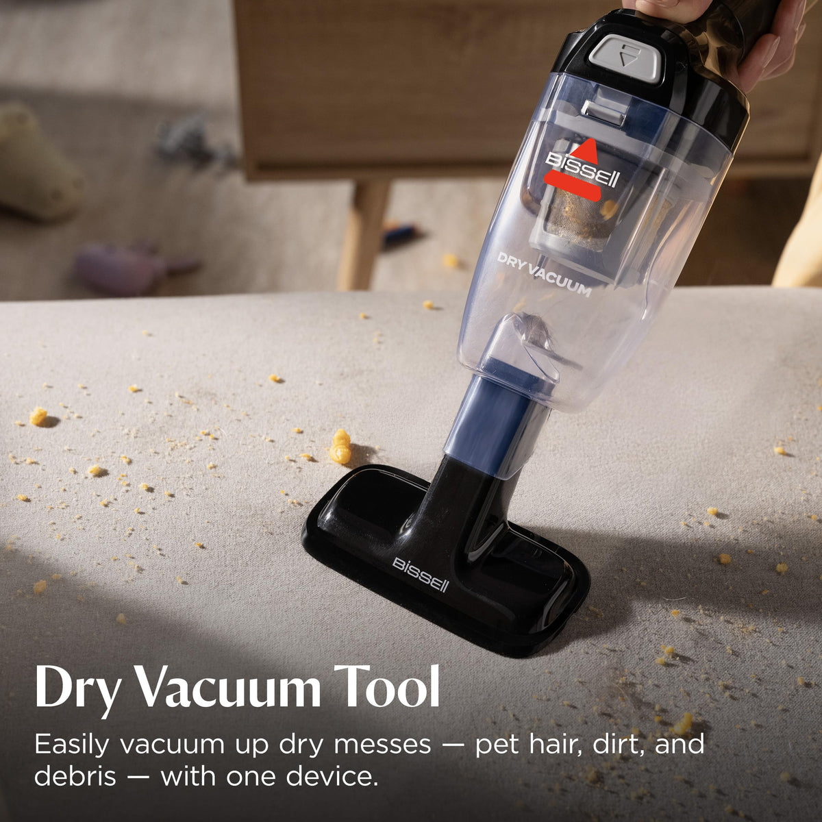 BISSELL spraying crevice tool reaching seat gap to remove hidden dirt effectively