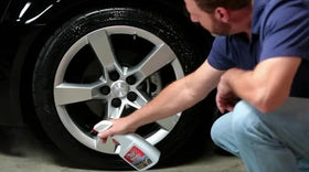 Black Magic used during a car wash for faster tire maintenance