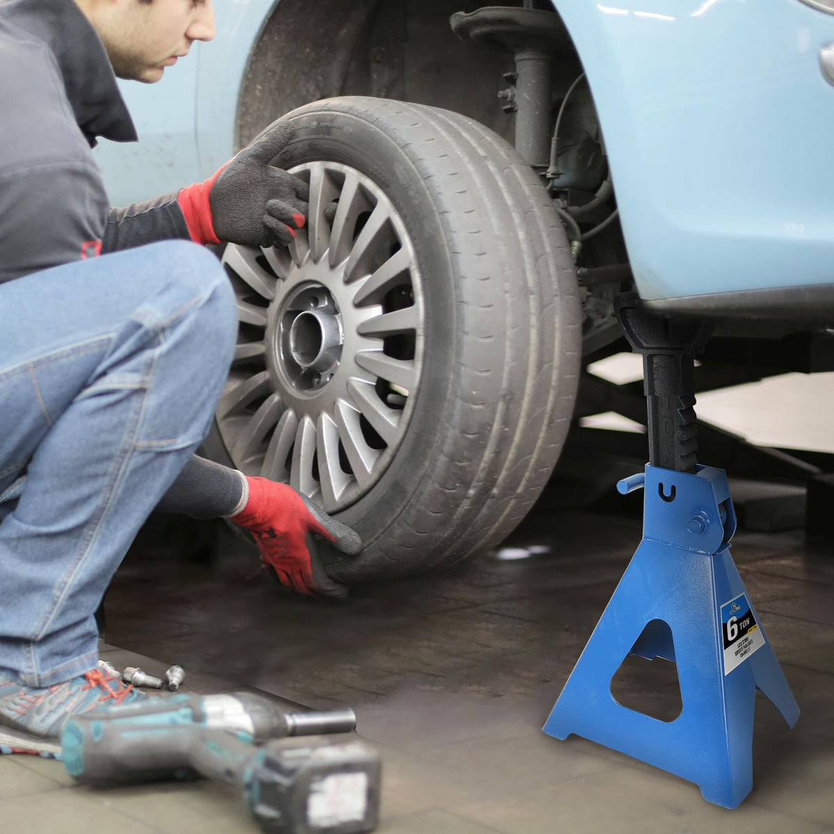 BLACKHORSE-RACING in-use garage shot with stands under vehicle showing practical maintenance safety