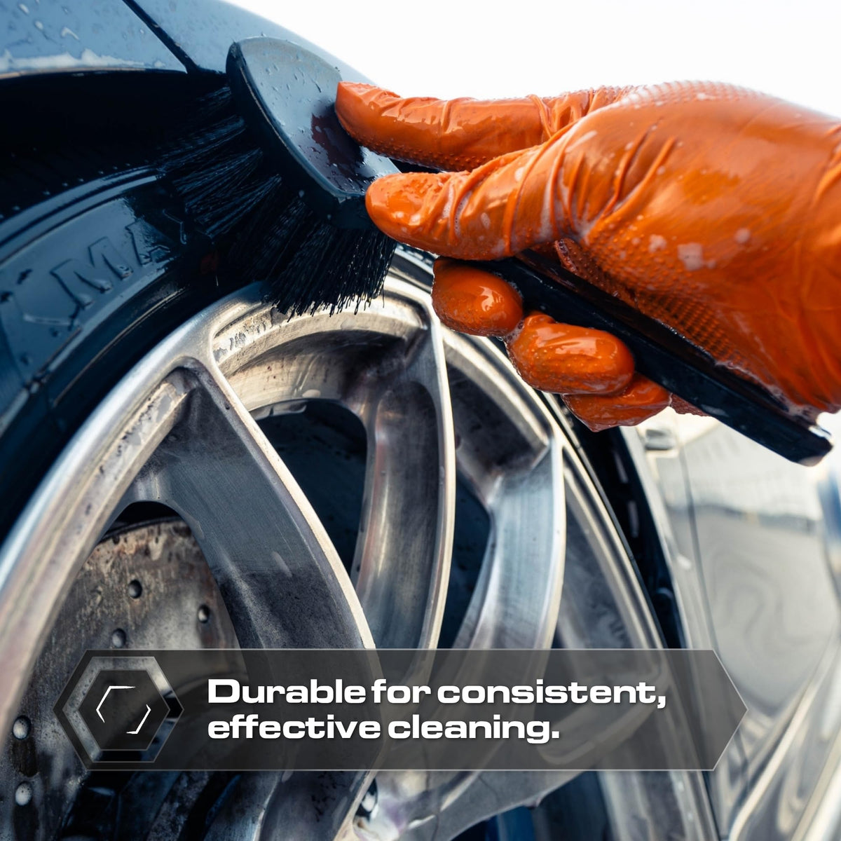 Blackline brush scrubbing a tire illustrating effective grime removal