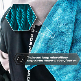 Blackline towel being glided across car hood for streak-free drying benefit