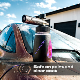 Blackline foam sprayed on car hood showing thick clinging suds for safer cleaning