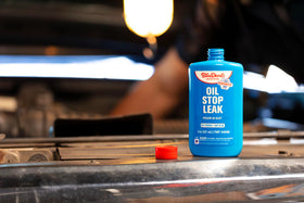 BlueDevil pouring into engine oil fill demonstrating quick, mess-free use