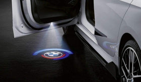 BMW M Performance projector installed in vehicle door illustrating simple slide insertion benefit